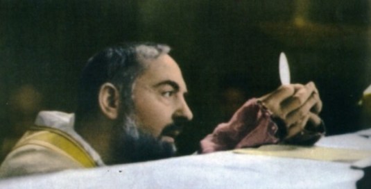 St. Padre Pio gazes at the Eucharistic Face of Christ