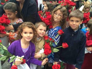 Children getting ready for procession with their roses photo: Patricia Enk